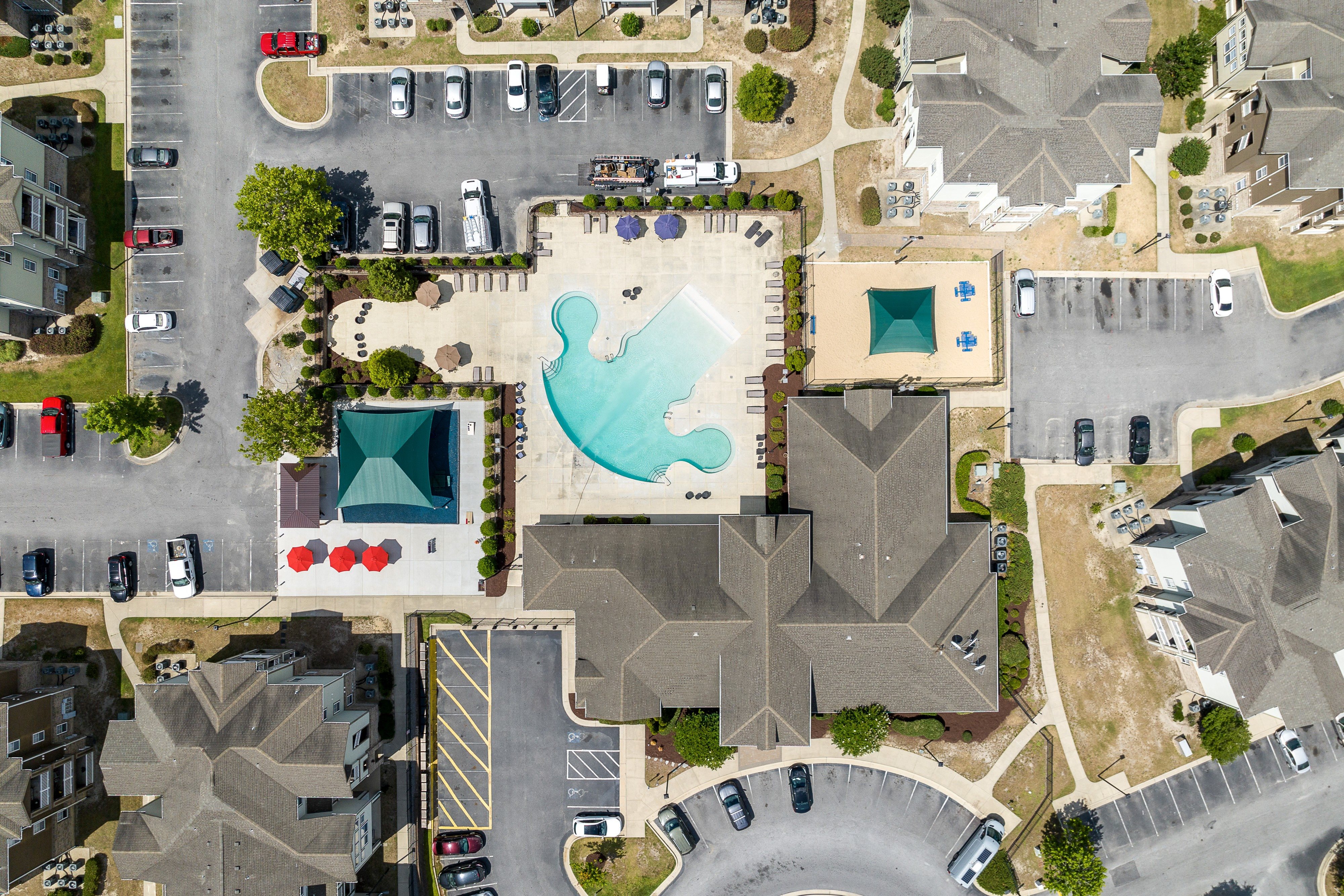 arial view of a swimming pool in a parking lot